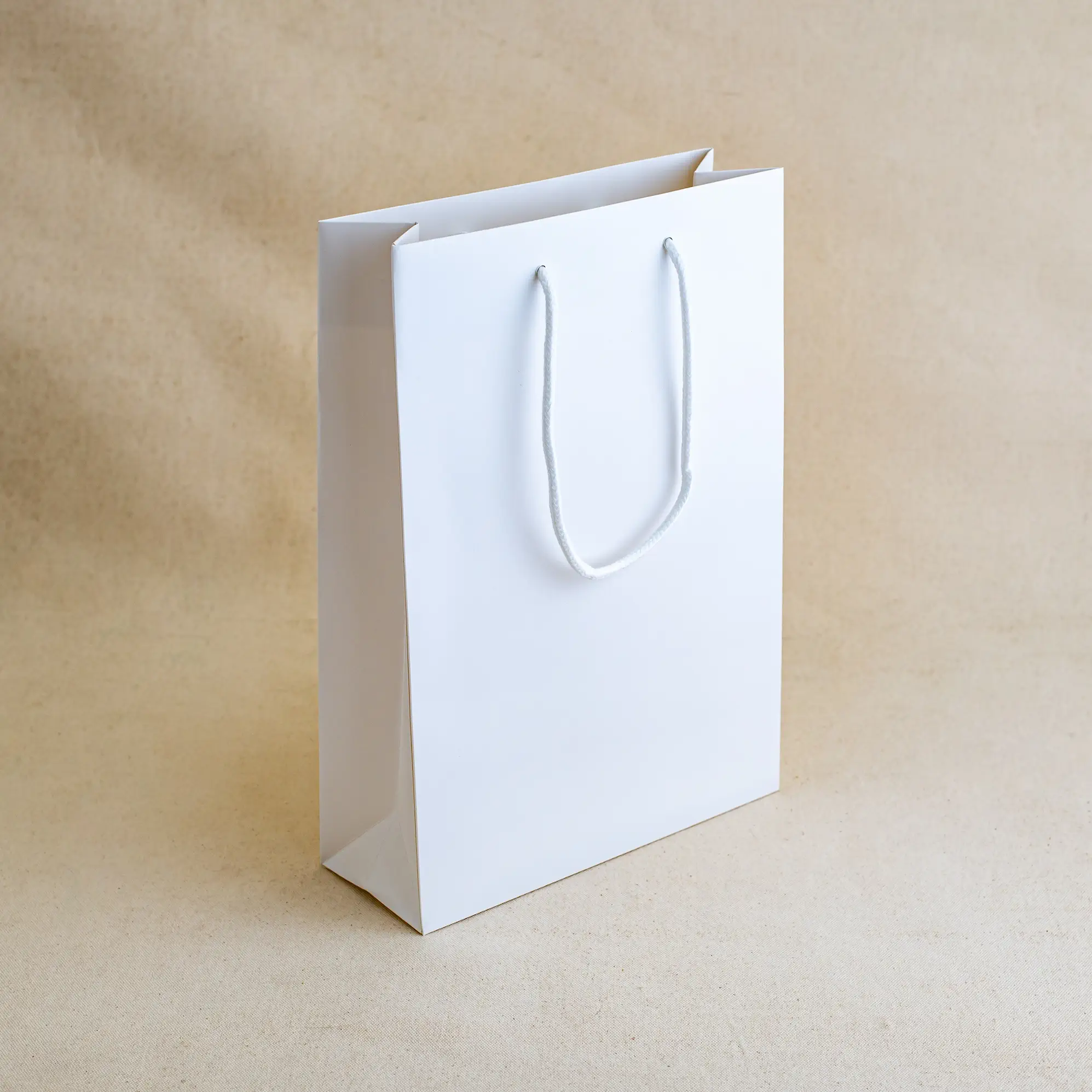 Show details for FSC® White Luxury Laminated Rope Handle Paper Bags - Plain