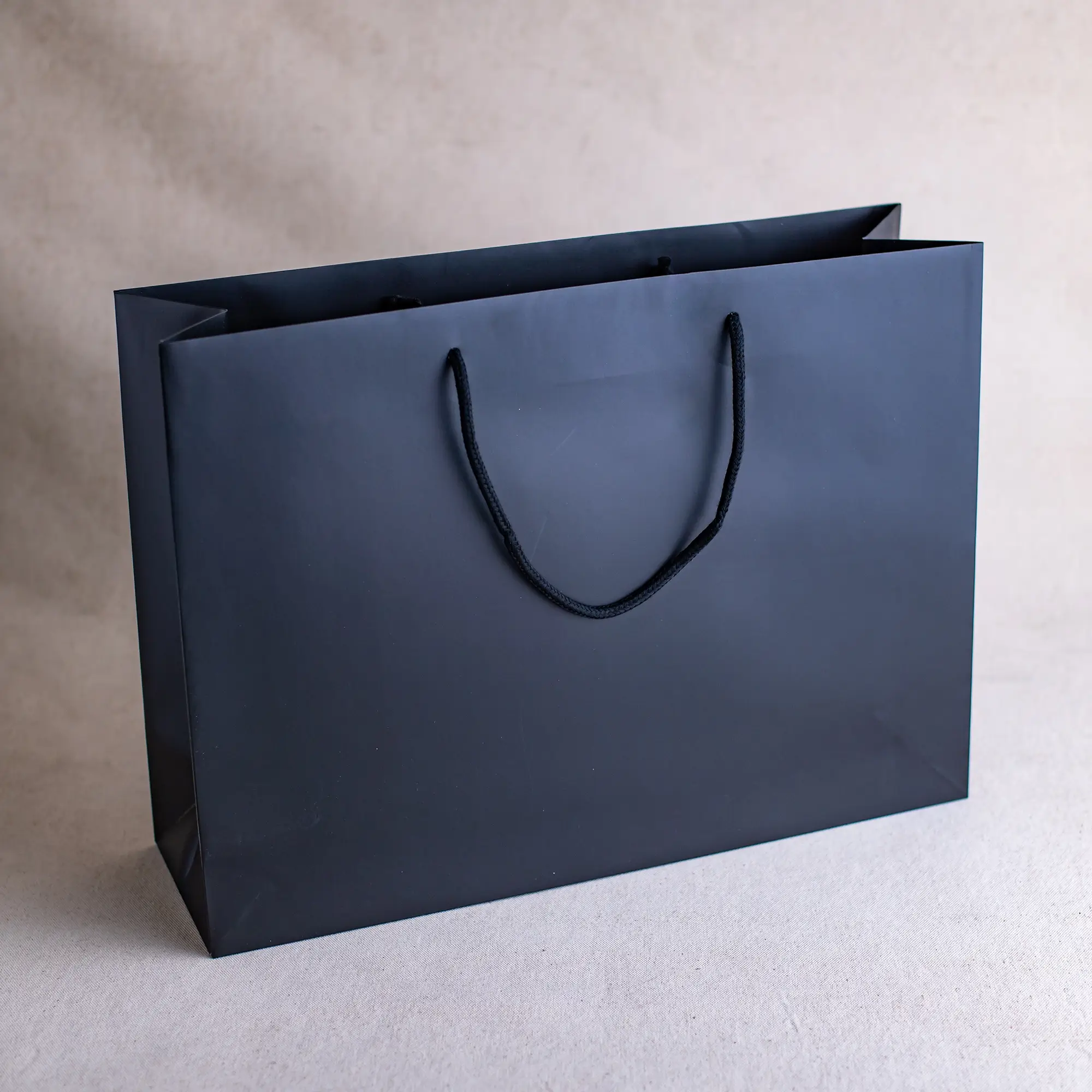 Show details for FSC® Black Luxury Laminated Rope Handle Paper Bags - Plain